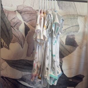 Set of 7 hard to find /retired print 18-24 month Kyte short sleeve bodysuits.